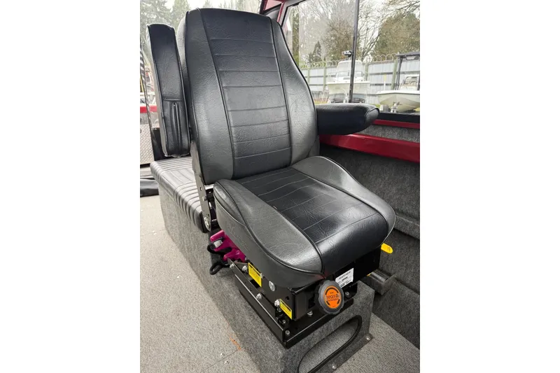 Slide: The Image of Storage compartment in a 2010 Thunder Jet 21 Luxor OB boat, containing a spray can and accessories. - 33