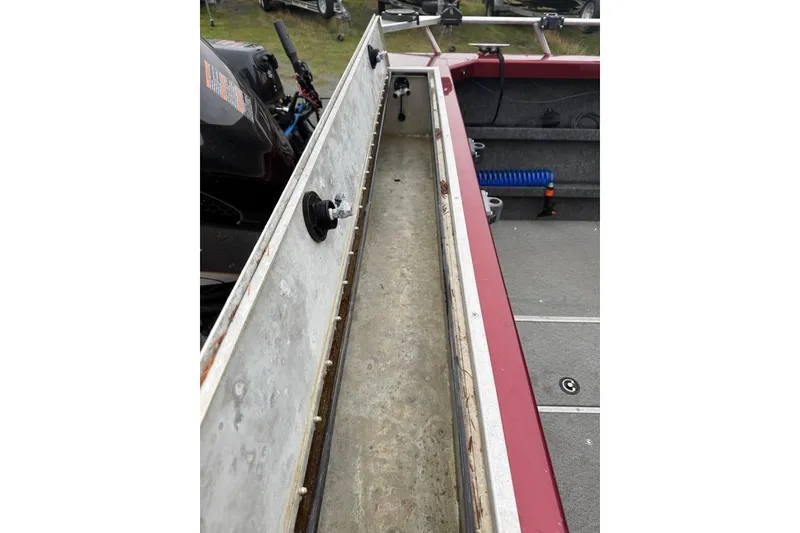 Slide: The Image of Interior of a 2010 Thunder Jet 21 Luxor OB boat with steering and control panels. - 36