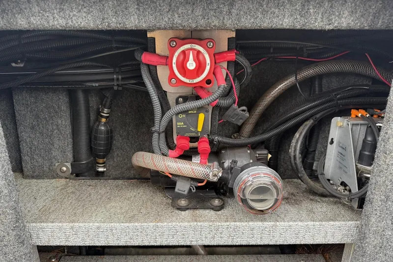 Slide: The Image of 2010 Thunder Jet 21 Luxor OB boat interior, showing storage compartment and deck details. - 38