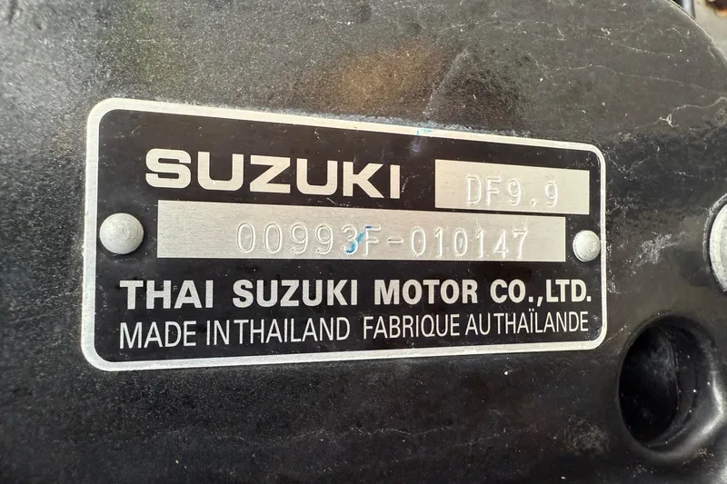 Slide: The Image of Suzuki DF9.9 engine label, Thai Suzuki Motor Co., Ltd., made in Thailand. - 51