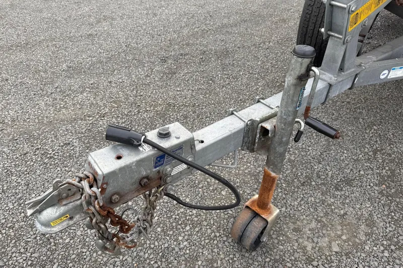 Slide: The Image of 2010 Thunder Jet 21 Luxor OB boat on trailer, parked outdoors. - 8