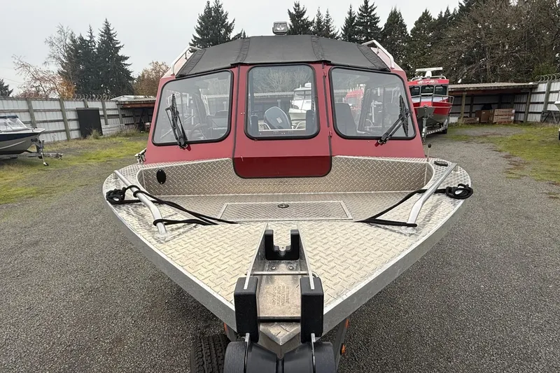 Slide: The Image of 2010 Thunder Jet 21 Luxor OB boat with red exterior and windshield wiper. - 9