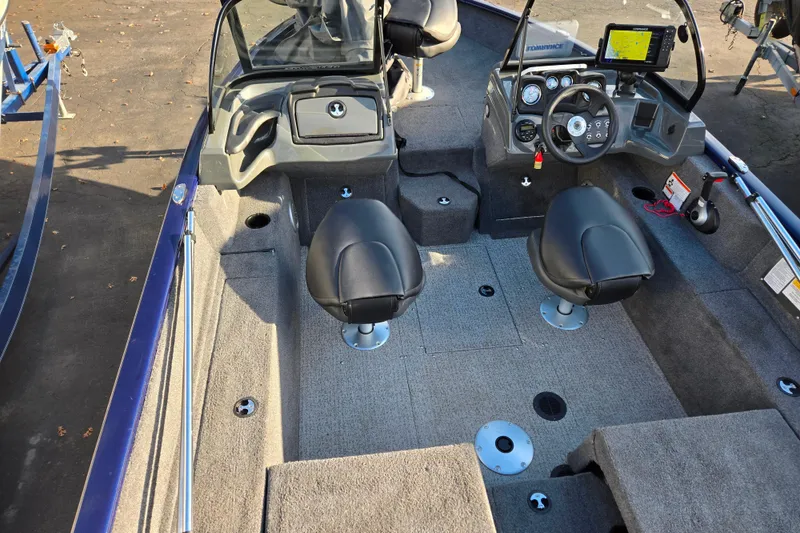 Slide: The Image of 2021 Tracker Pro Guide V-175 Combo boat interior with dual seats and control panel. - 101