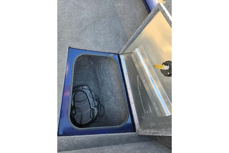 Slide: The Image of 2021 Tracker Pro Guide V-175 Combo storage compartment with pedal inside. - 85