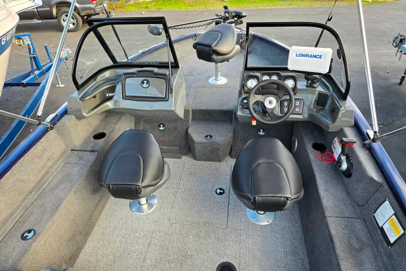 Slide: The Image of 2021 Tracker Pro Guide V-175 Combo boat interior with steering console and seating. - 86