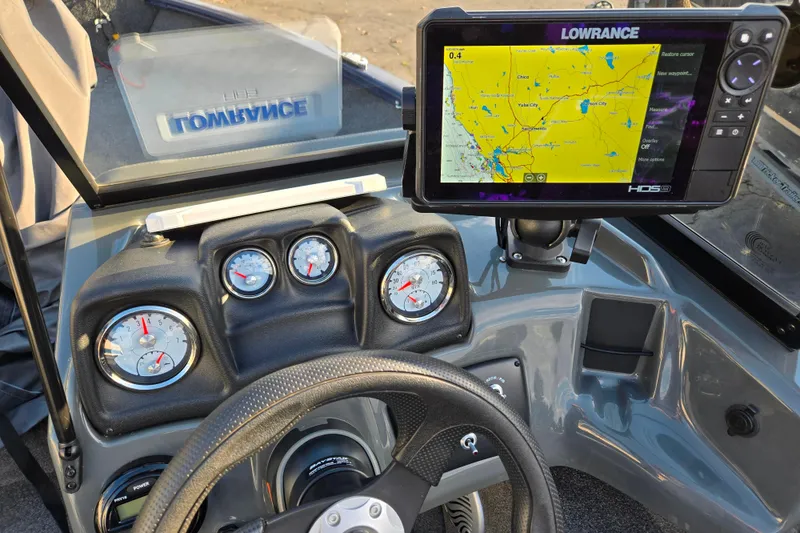 Slide: The Image of 2021 Tracker Pro Guide V-175 Combo dashboard with Lowrance GPS and gauges. - 99