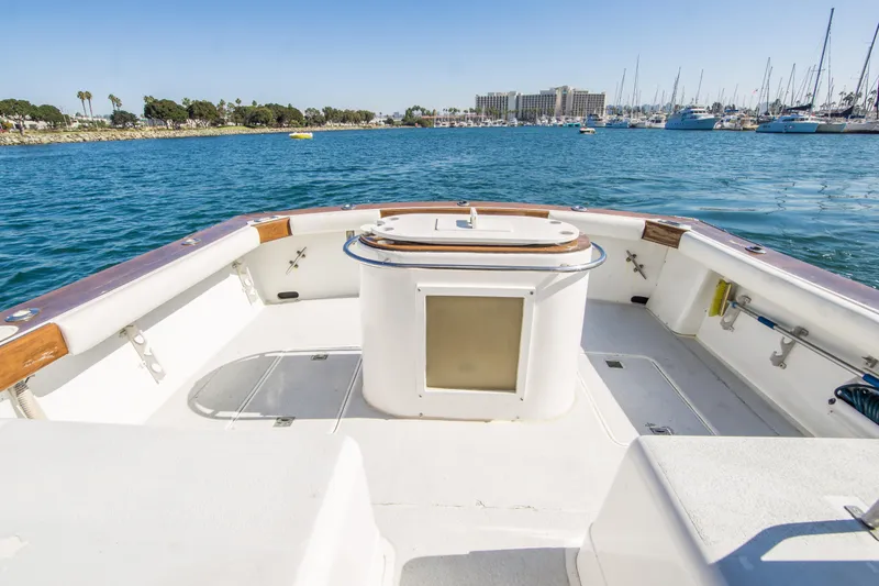 Slide: The Image of 1987 Blackfin 32 Flybridge boat deck with ocean and marina view. - 16