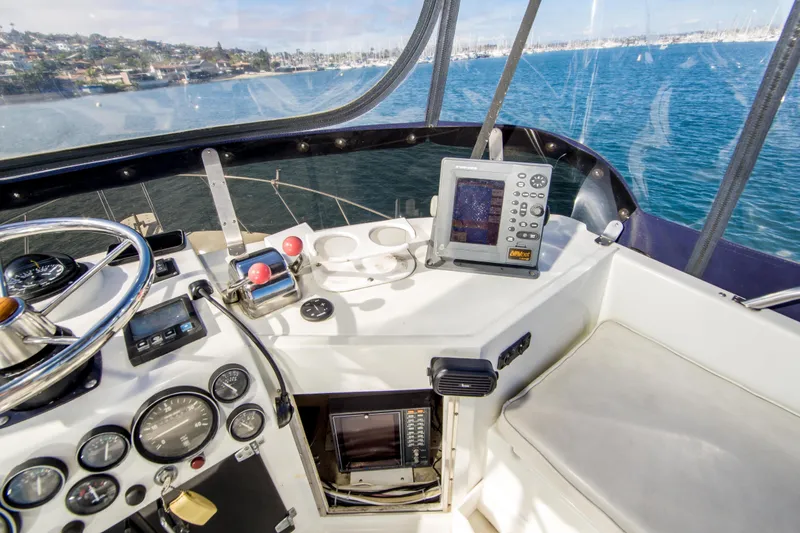 Slide: The Image of 1987 Blackfin 32 Flybridge helm with navigation equipment and ocean view. - 46