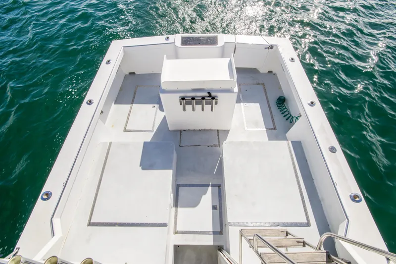 Slide: The Image of 1987 Blackfin 32 Flybridge boat deck with ocean view, featuring spacious layout and clean design. - 60