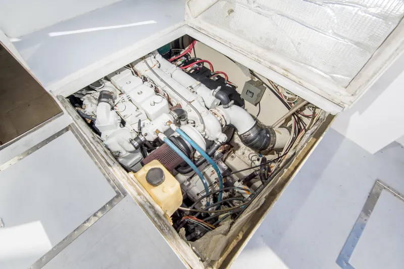 Slide: The Image of Engine compartment of a 1987 Blackfin 32 Flybridge boat, showcasing mechanical components. - 63