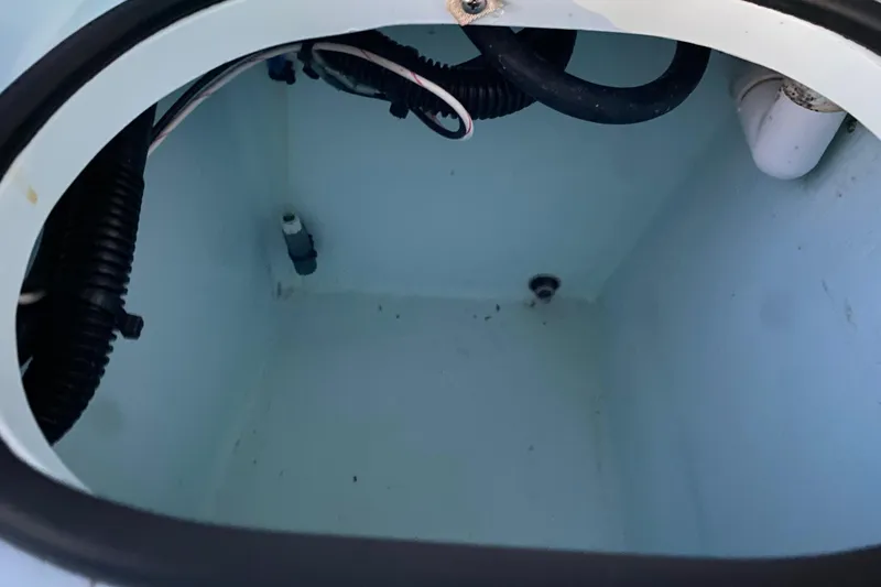 Slide: The Image of 2005 Hell's Bay Devilray boat compartment with wiring and drainage. - 16