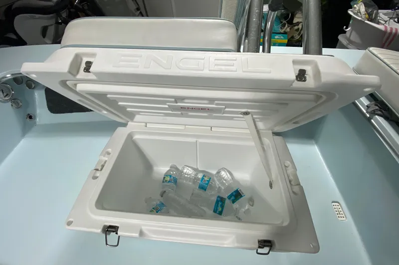 Slide: The Image of Open Engel cooler with water bottles inside on a 2005 Hell's Bay Devilray boat. - 22