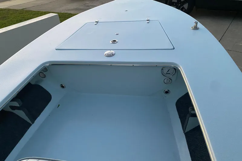 Slide: The Image of 2005 Hell's Bay Devilray boat interior, featuring storage compartment and clean design. - 8