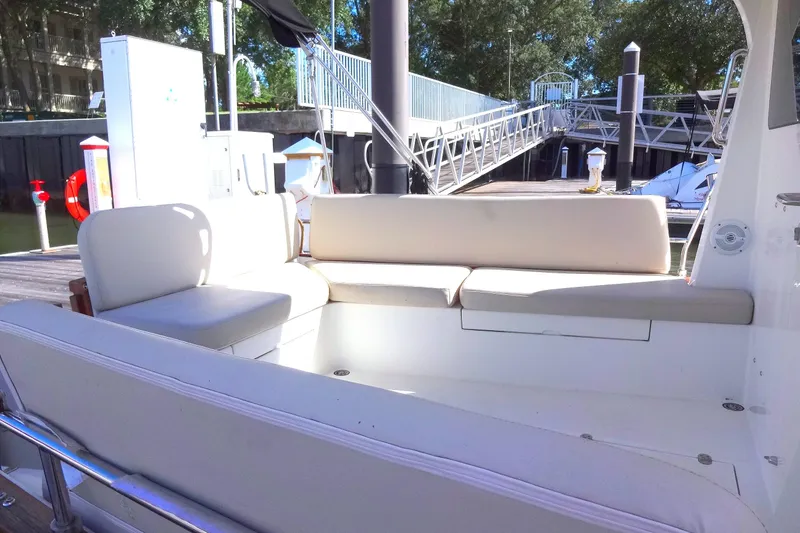 Slide: The Image of Cozy seating area on 2016 North Aegean Trawler 30 at marina dock. - 21