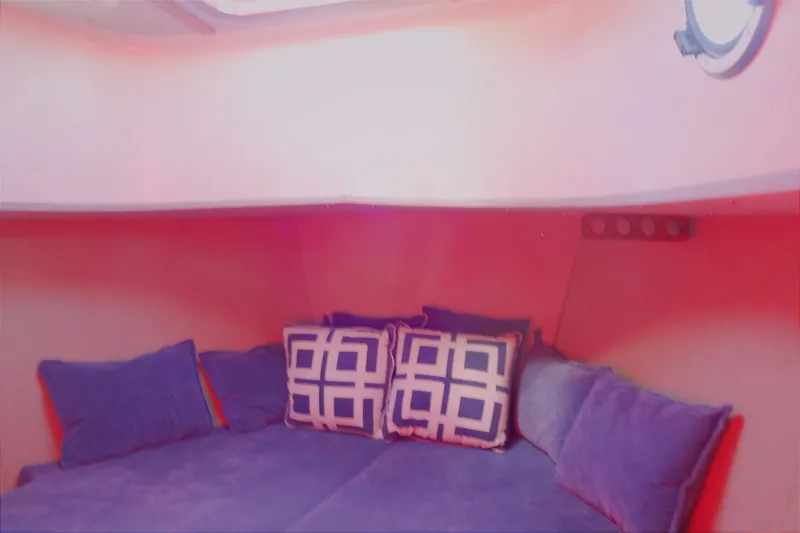 Slide: The Image of Cozy cabin interior of 2016 North Aegean Trawler 30 with blue cushions and geometric pillows. - 41
