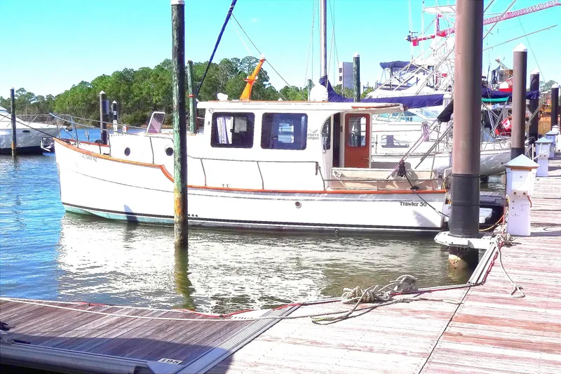 Slide: The Image of 2016 North Aegean Trawler 30 docked at a marina on a sunny day. - 5