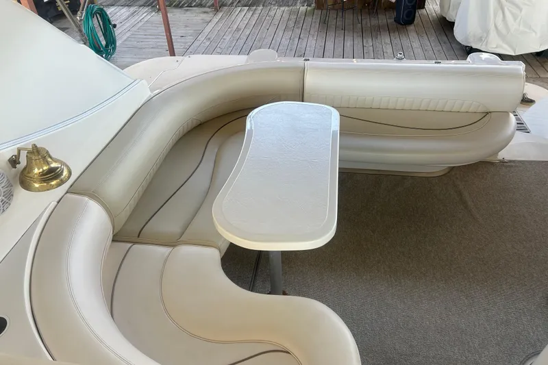 Slide: The Image of Luxurious seating area on a 1997 Cruisers 4270 yacht with elegant white upholstery. - 19