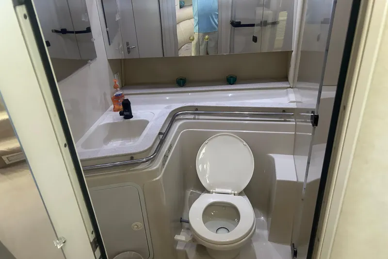 Slide: The Image of Bathroom interior of 1997 Cruisers 4270 yacht with sink and toilet. - 30