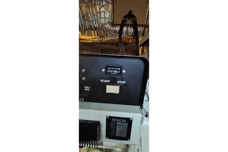 Slide: The Image of Control panel of a 1997 Cruisers 4270 boat with Kohler generator. - 38