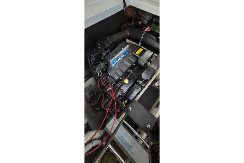 Slide: The Image of 1997 Cruisers 4270 engine compartment with MerCruiser engine and wiring. - 11