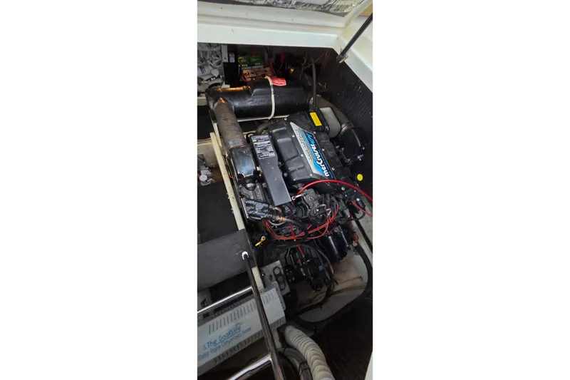 Slide: The Image of 1997 Cruisers 4270 engine compartment with MerCruiser engine and wiring. - 27