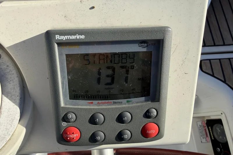Slide: The Image of Raymarine autopilot display on 2008 Beneteau 31 sailboat, showing standby mode. - 13