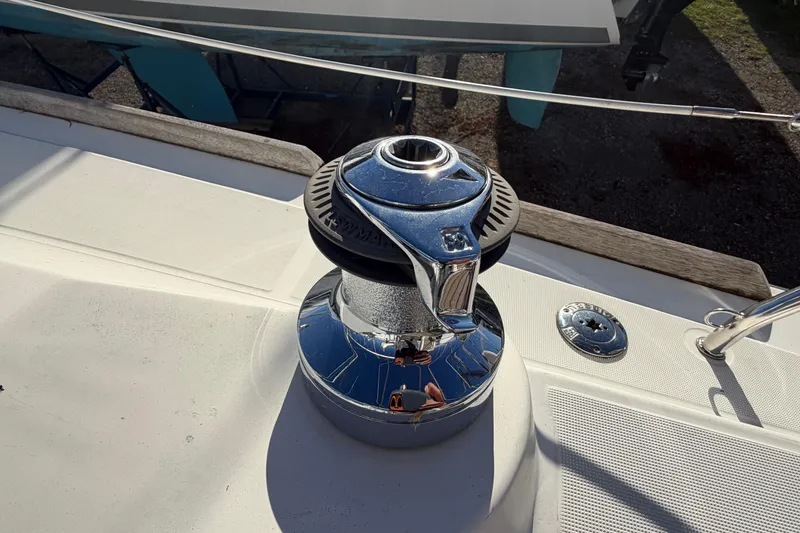Slide: The Image of Close-up of a winch on a 2008 Beneteau 31 sailboat deck. - 16