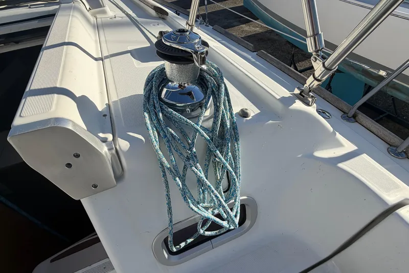 Slide: The Image of Deck of 2008 Beneteau 31 sailboat with winch and coiled rope. - 18