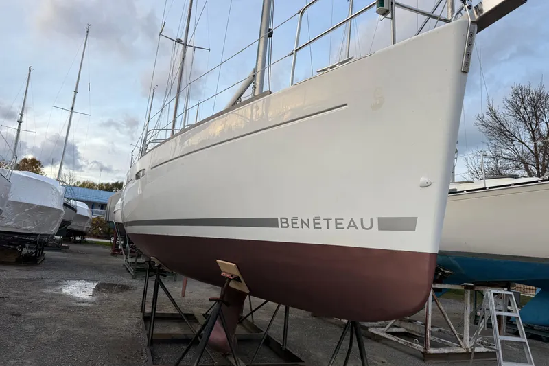 Slide: The Image of 2008 Beneteau 31 sailboat on stands, ready for maintenance in a boatyard. - 2