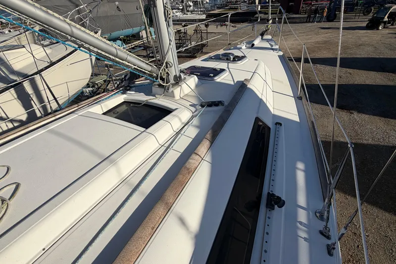 Slide: The Image of 2008 Beneteau 31 sailboat deck view, showcasing rigging and sleek design. - 20