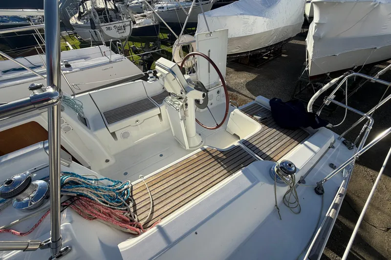 Slide: The Image of 2008 Beneteau 31 sailboat cockpit with steering wheel and deck view. - 28