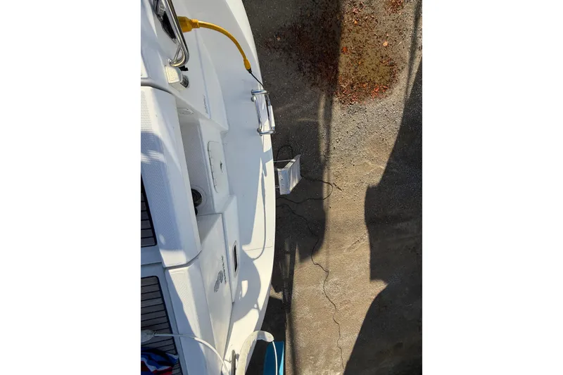 Slide: The Image of 2008 Beneteau 31 boat stern view with dockside power connection. - 32