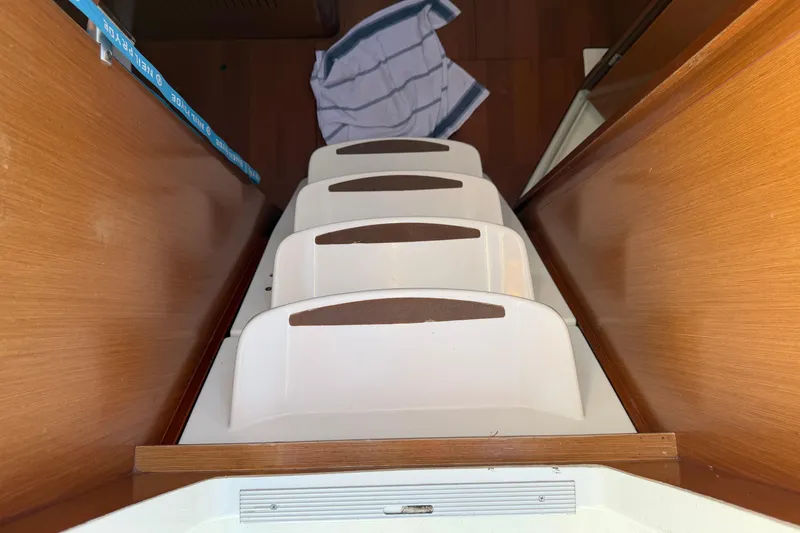Slide: The Image of Interior stairs of a 2008 Beneteau 31 sailboat with wooden finish. - 33