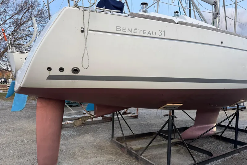Slide: The Image of 2008 Beneteau 31 sailboat on stands, showcasing hull and keel design. - 4