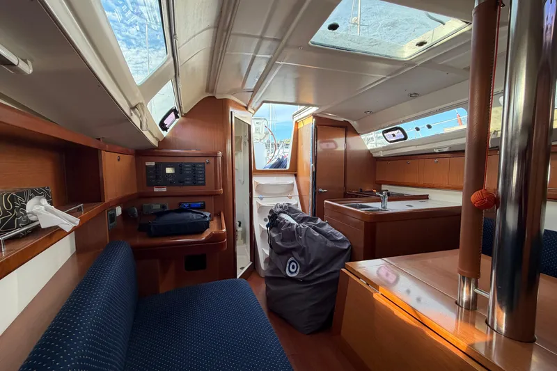 Slide: The Image of Interior of 2008 Beneteau 31 sailboat with wood finish and modern amenities. - 46