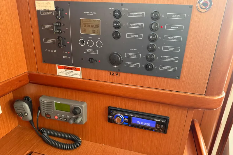 Slide: The Image of Control panel of a 2008 Beneteau 31 sailboat with radio and audio system. - 48