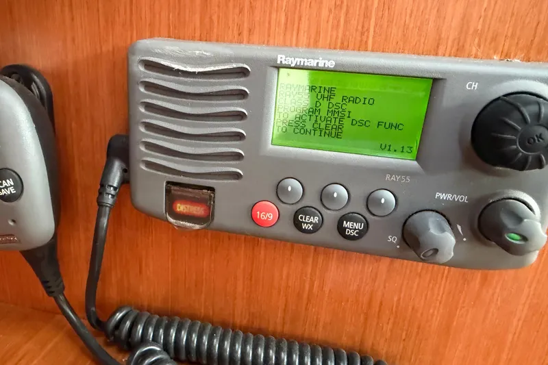 Slide: The Image of Raymarine VHF radio on 2008 Beneteau 31 sailboat, displaying DSC function instructions. - 51