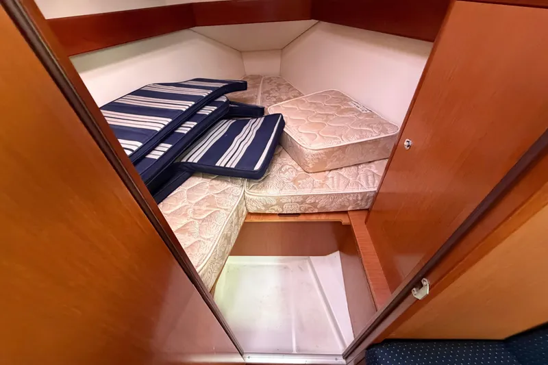 Slide: The Image of Cozy cabin interior of 2008 Beneteau 31 sailboat with mattresses and cushions. - 60