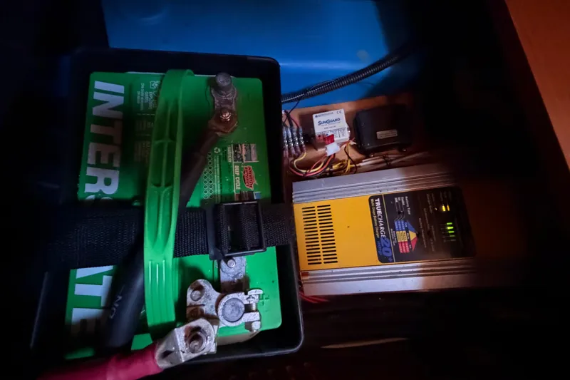 Slide: The Image of Battery and charger setup in a 2008 Beneteau 31 sailboat. - 66