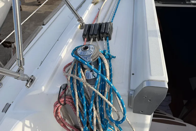 Slide: The Image of Deck of 2008 Beneteau 31 sailboat with winch and colorful ropes. - 69