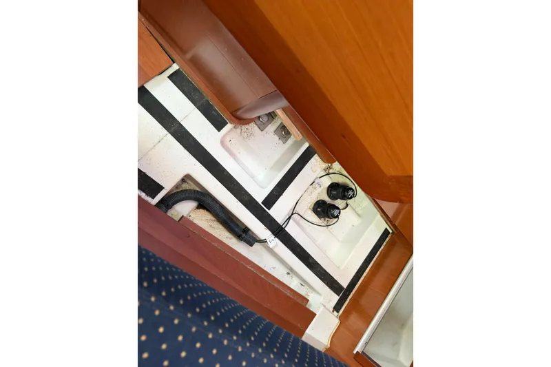 Slide: The Image of Interior view of a 2008 Beneteau 31 sailboat, showing bilge area and components. - 71