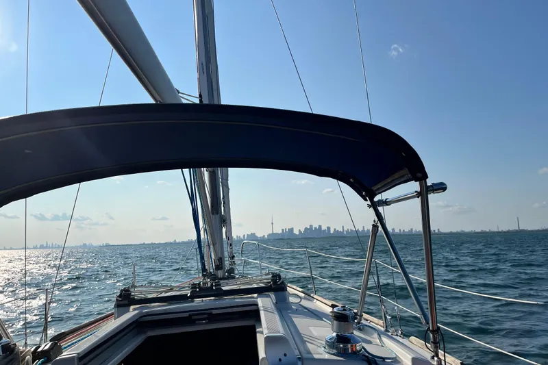 Slide: The Image of Sailing on a 2008 Beneteau 31 with city skyline in the background. - 79
