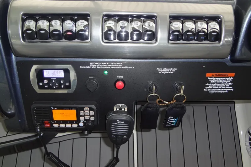 Slide: The Image of Control panel of a 2019 Formula 400 Super Sport boat with switches and communication devices. - 13