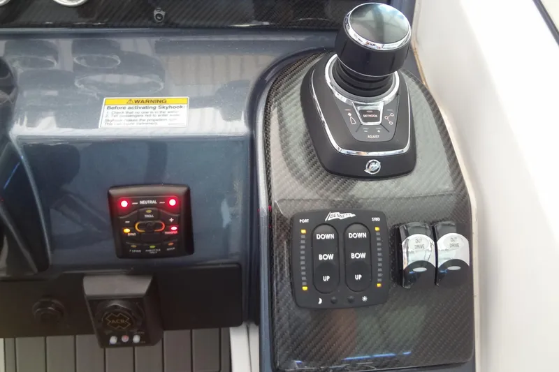 Slide: The Image of Control panel of a 2019 Formula 400 Super Sport boat with joystick and trim controls. - 14