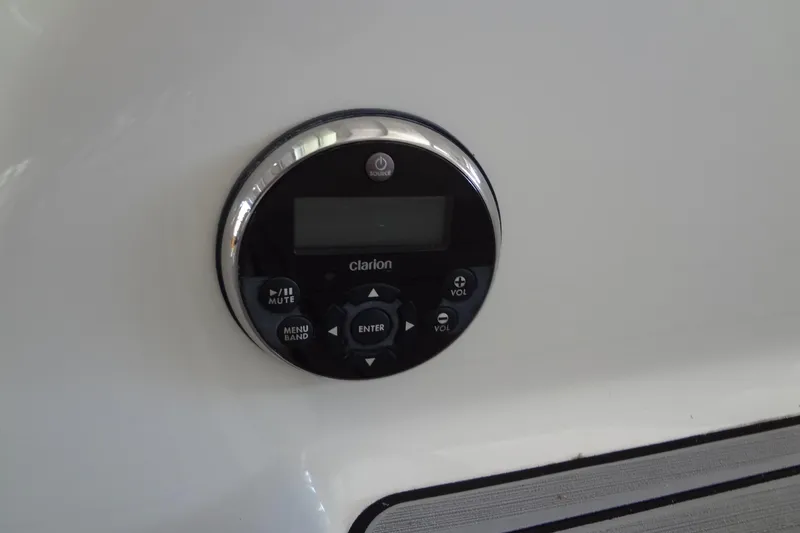 Slide: The Image of Control panel of a 2019 Formula 400 Super Sport boat, featuring Clarion audio system. - 18