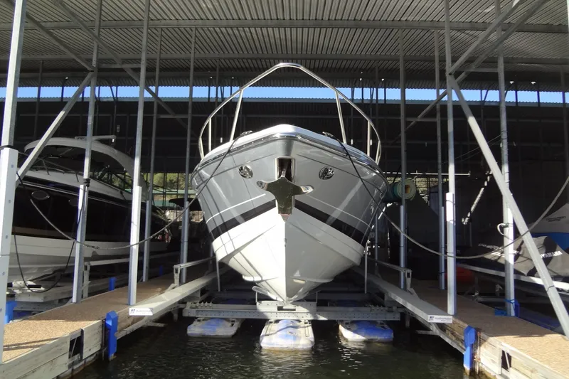 Slide: The Image of 2019 Formula 400 Super Sport boat docked in a covered marina. - 2