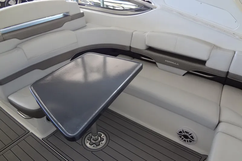 Slide: The Image of 2019 Formula 400 Super Sport boat interior with sleek seating and table. - 20