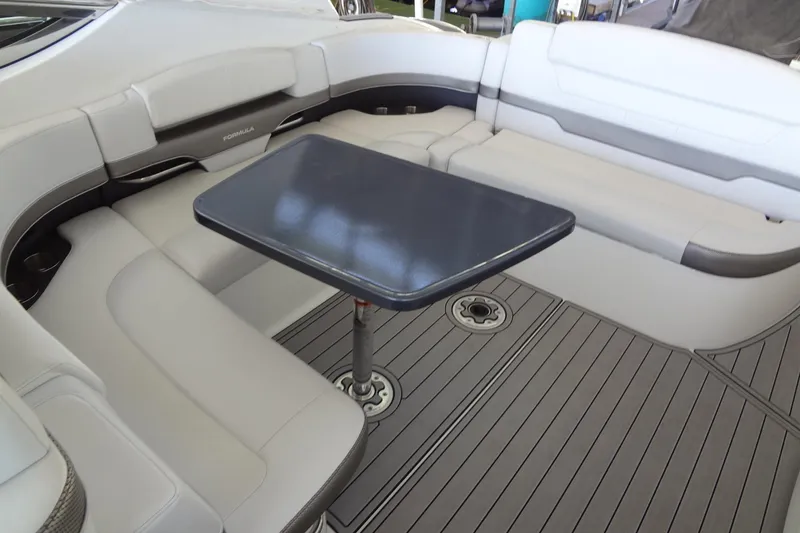 Slide: The Image of 2019 Formula 400 Super Sport boat interior with sleek seating and a central table. - 21