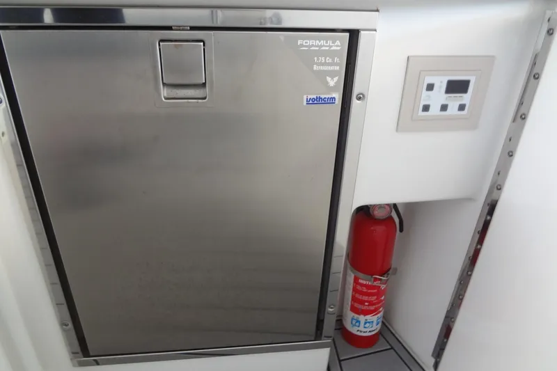 Slide: The Image of 2019 Formula 400 Super Sport interior with refrigerator and fire extinguisher. - 24