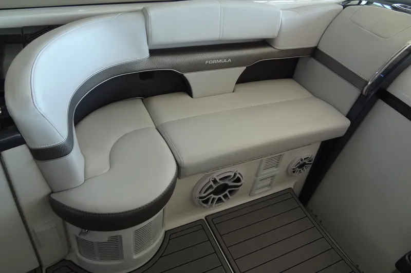 Slide: The Image of 2019 Formula 400 Super Sport boat interior seating with speakers and modern design. - 26